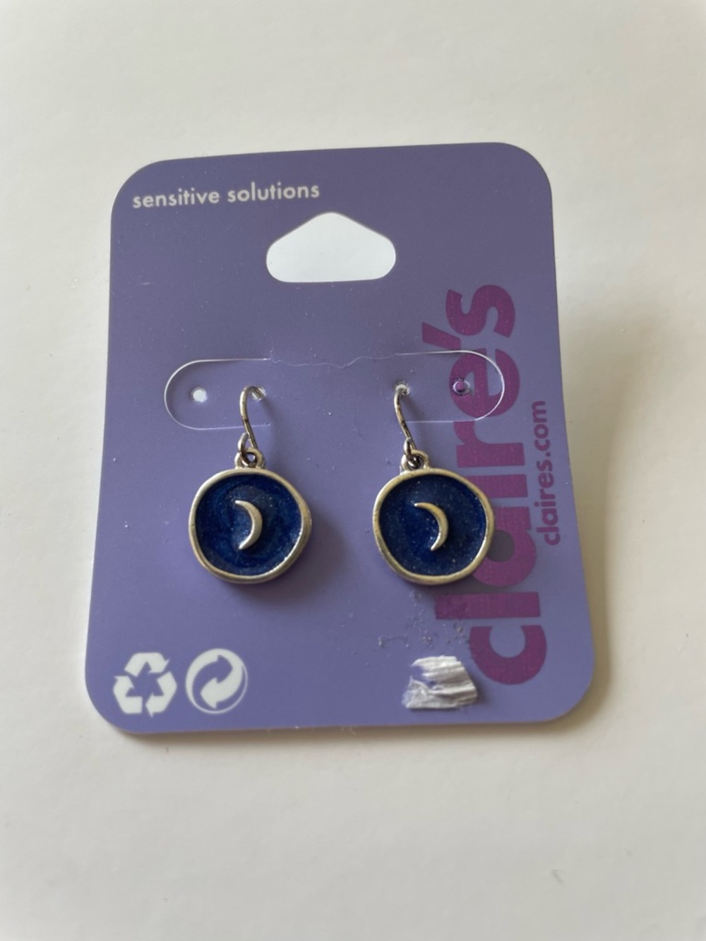 Claire's crescent moon dangle earrings.